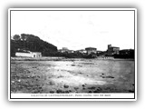 1929 - Al limite dei pini si nota la sagoma mozza della nuova chiesa. A sx i rimessaggi Cardon e Faccenda.